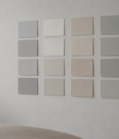 Blank paper cards arranged in columns on a wall